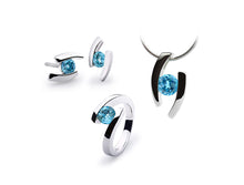 Load image into Gallery viewer, Blue Topaz and Garnet jewelry set in sterling silver by Joryel Vera - view 4
