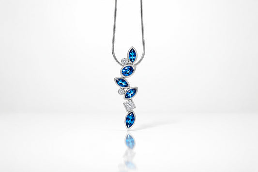 Garnet and London Blue Topaz pendant in sterling silver by Joryel Vera, style P3844