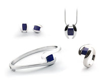 Load image into Gallery viewer, Blue Topaz and Garnet jewelry set in sterling silver by Joryel Vera - view 3