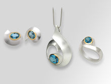 Load image into Gallery viewer, Blue Topaz and Garnet jewelry set in sterling silver by Joryel Vera