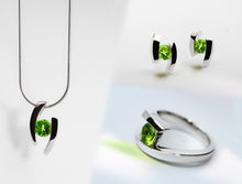 Load image into Gallery viewer, Blue Topaz and Garnet jewelry set in sterling silver by Joryel Vera - view 2