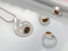 Load image into Gallery viewer, Blue Topaz and Garnet jewelry set in sterling silver by Joryel Vera - view 2